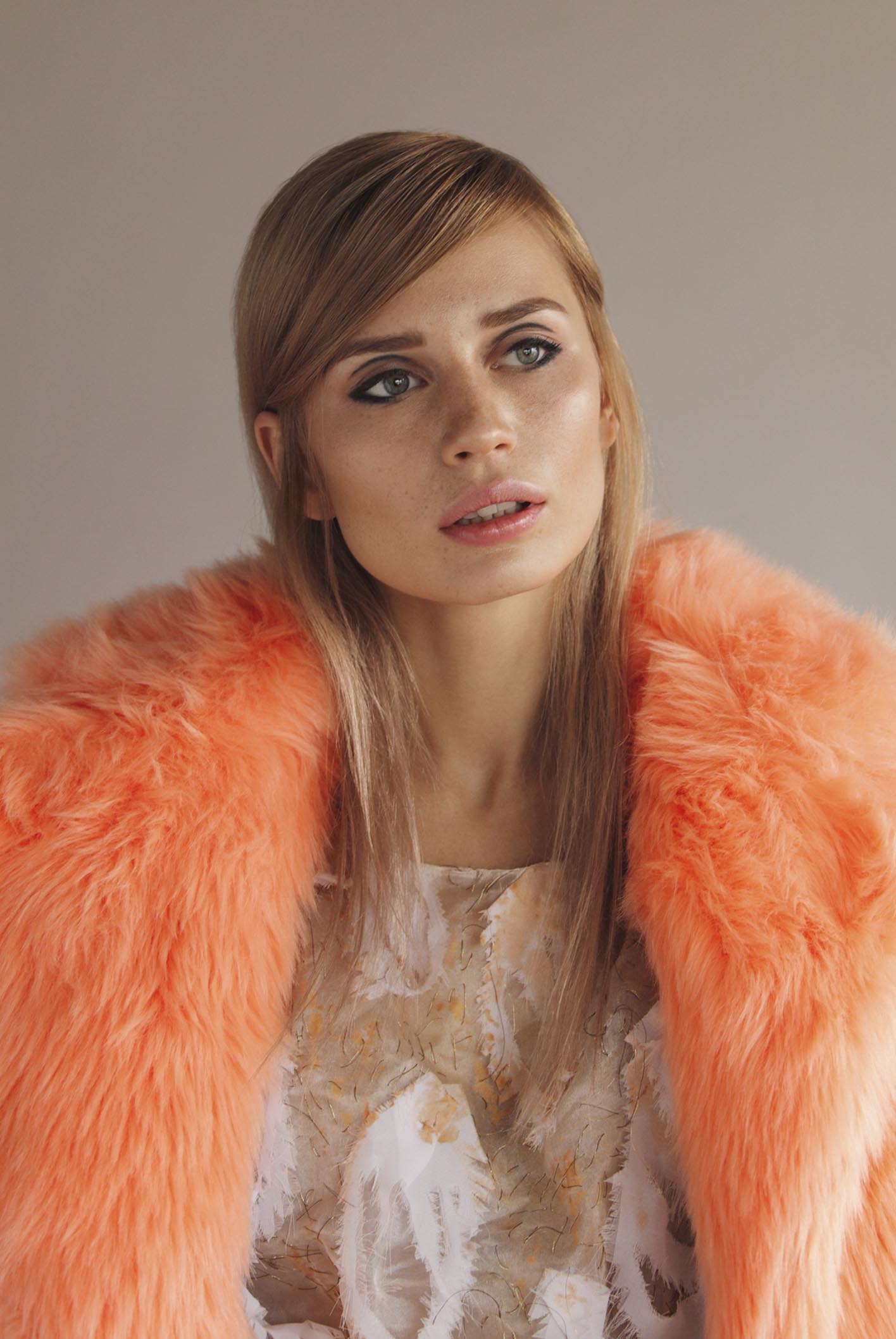 Orange faux store fur coat